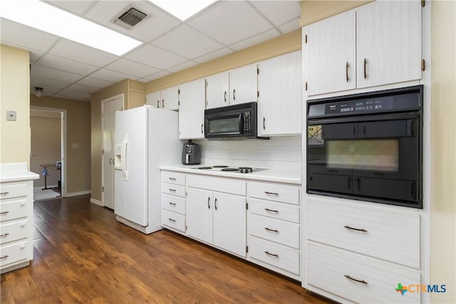 1322 Rivercrest Dr, New Braunfels, TX 78130 - kitchen with black appliances, light countertops, dark wood finished floors, and a paneled ceiling