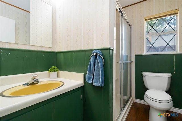 1322 Rivercrest Dr, New Braunfels, TX 78130 - full bathroom featuring wallpapered walls, vanity, a stall shower, toilet, and wood finished floors