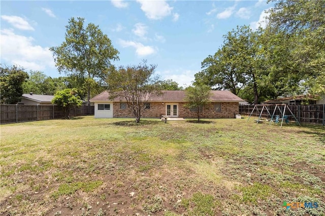 1322 Rivercrest Dr, New Braunfels, TX 78130 - rear view of house with french doors, a playground, and brick siding