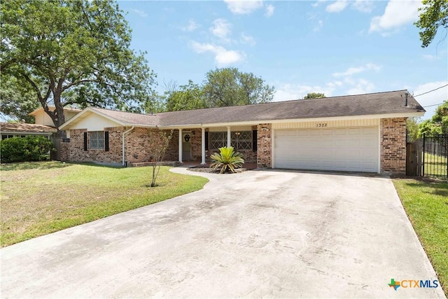 1322 Rivercrest Dr, New Braunfels, TX 78130 - ranch-style house featuring brick siding, concrete driveway, and a garage