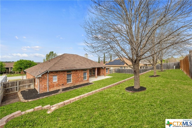 exterior space featuring a yard and a patio area