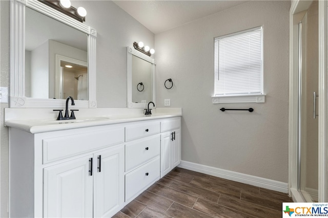 bathroom featuring vanity and hardwood / wood-style flooring