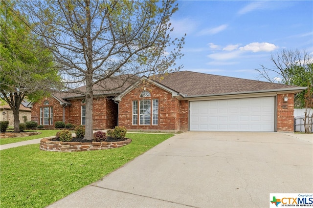 ranch-style house featuring a front lawn and a garage