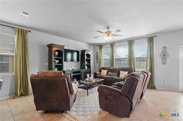 125 Flint Rock Ct, Victoria, TX 77904 - living room featuring ceiling fan, light tile patterned floors, and baseboards