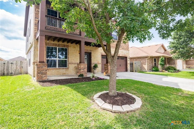 125 Flint Rock Ct, Victoria, TX 77904 - view of front of home featuring concrete driveway, brick siding, an attached garage, and a balcony