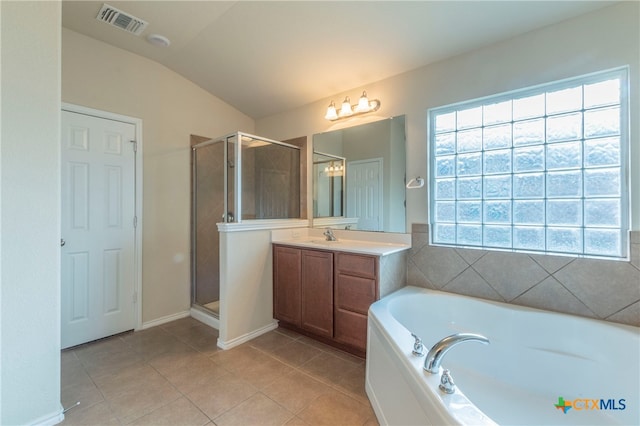 bathroom featuring vanity, lofted ceiling, tile patterned floors, and shower with separate bathtub