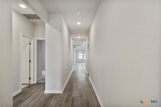 hallway featuring dark hardwood / wood-style flooring