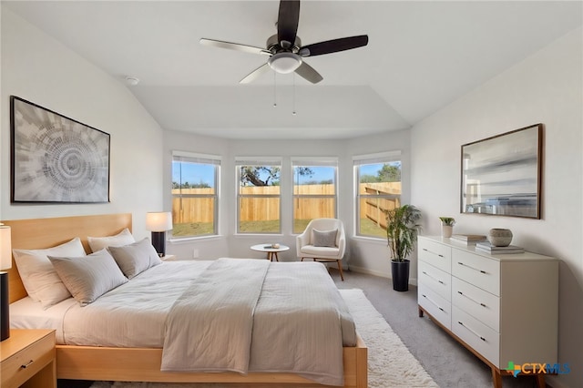 bedroom with ceiling fan, light colored carpet, and lofted ceiling