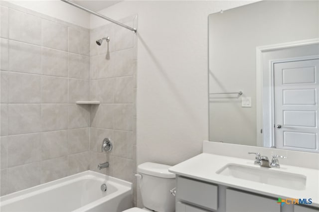 full bathroom with vanity, toilet, and tiled shower / bath combo