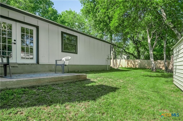 view of yard featuring french doors