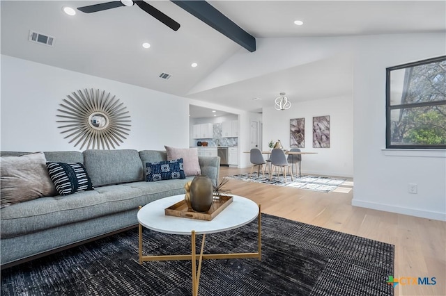 living area featuring light wood finished floors, baseboards, ceiling fan, and recessed lighting