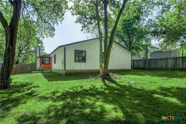 back of house with board and batten siding