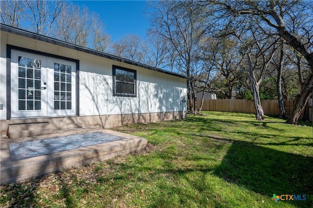 view of property exterior featuring french doors