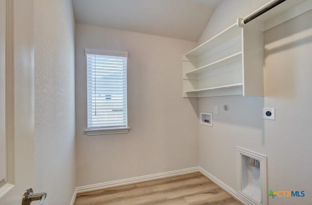 2829 Maximilian Ln, New Braunfels, TX 78130 - washroom with hookup for an electric dryer, washer hookup, light wood-style flooring, and hookup for a gas dryer