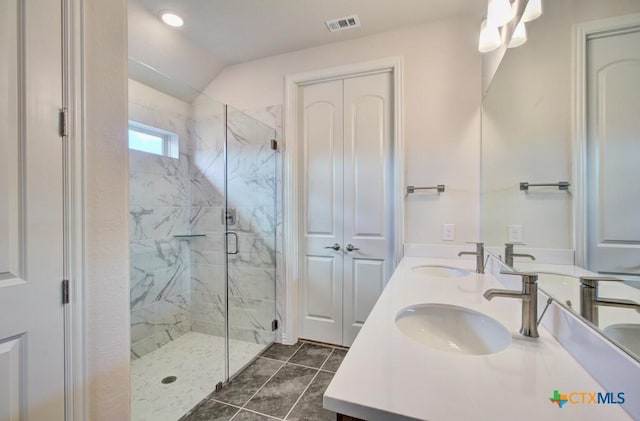 2829 Maximilian Ln, New Braunfels, TX 78130 - full bath with a marble finish shower, double vanity, and vaulted ceiling