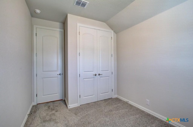 2829 Maximilian Ln, New Braunfels, TX 78130 - unfurnished bedroom with light colored carpet, a closet, and lofted ceiling