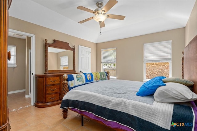 2153 Keystone Dr, New Braunfels, TX 78130 - bedroom featuring light tile patterned floors, baseboards, ceiling fan, and lofted ceiling
