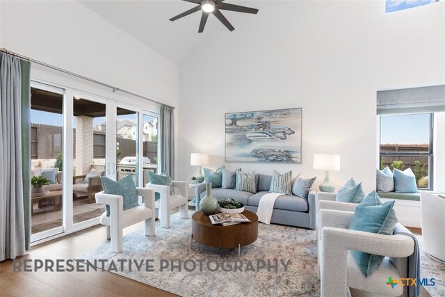 221 Dycus Bnd, Liberty Hill, TX 78642 - living room featuring a ceiling fan, high vaulted ceiling, and wood finished floors