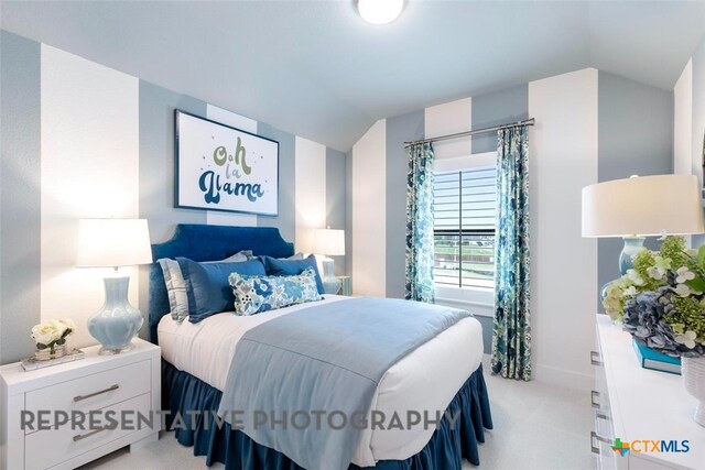 221 Dycus Bnd, Liberty Hill, TX 78642 - bedroom with vaulted ceiling and light colored carpet