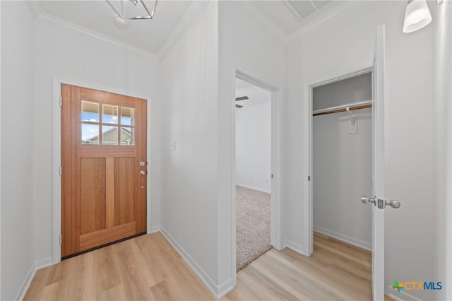 607 Killam Dr, Temple, TX 76502 - doorway with crown molding, light wood finished floors, and baseboards