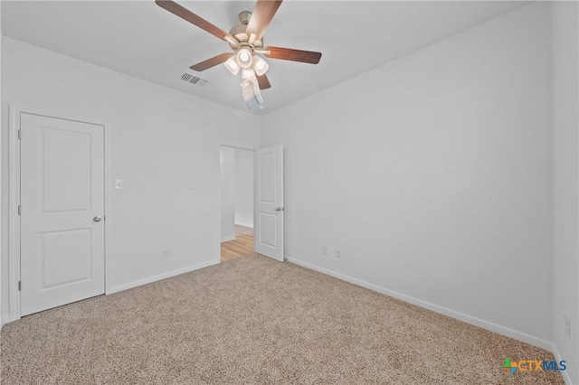 607 Killam Dr, Temple, TX 76502 - unfurnished bedroom with light colored carpet, baseboards, and ceiling fan