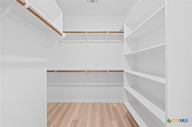 607 Killam Dr, Temple, TX 76502 - walk in closet with wood finished floors