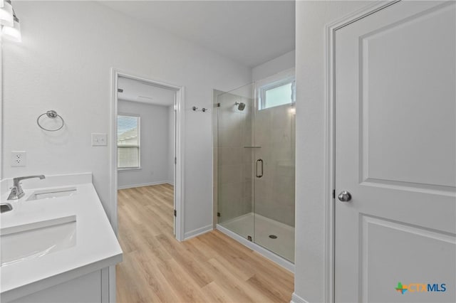 607 Killam Dr, Temple, TX 76502 - bathroom with a shower stall, healthy amount of natural light, wood finished floors, and baseboards