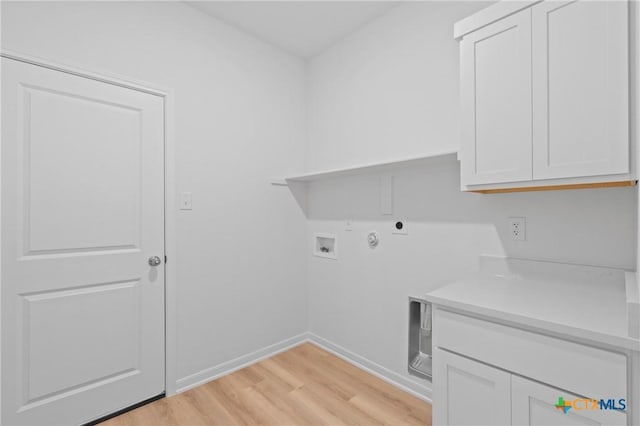 607 Killam Dr, Temple, TX 76502 - clothes washing area featuring cabinet space, light wood finished floors, baseboards, hookup for a washing machine, and gas dryer hookup