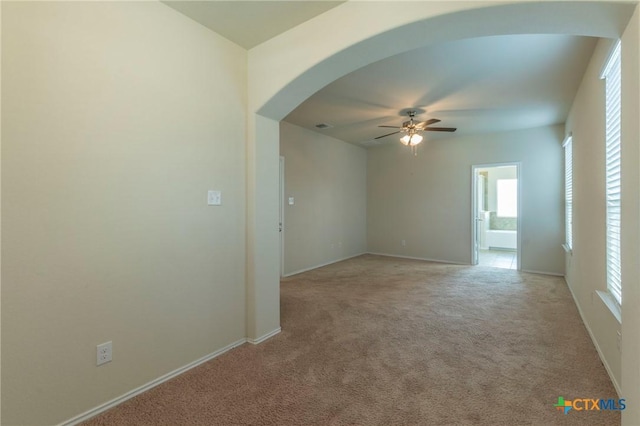 carpeted empty room with ceiling fan