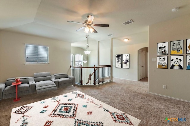 game room with ceiling fan, carpet, and lofted ceiling