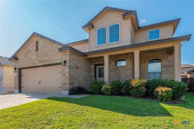 view of front of home featuring a garage and a front yard