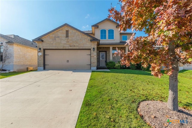 view of front of house with a garage and a front lawn