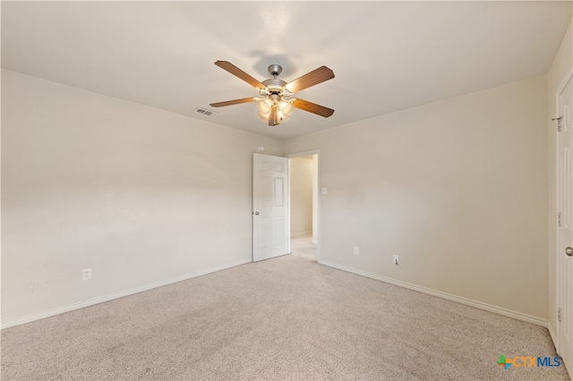 unfurnished room featuring ceiling fan and light colored carpet