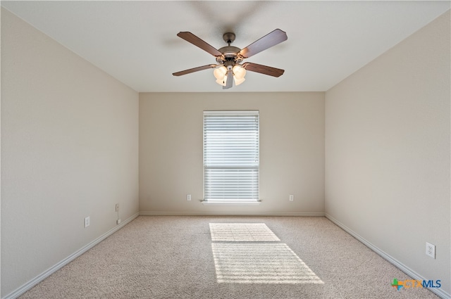 spare room featuring ceiling fan and light carpet