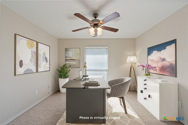 unfurnished bedroom featuring ceiling fan, light colored carpet, a walk in closet, and multiple windows