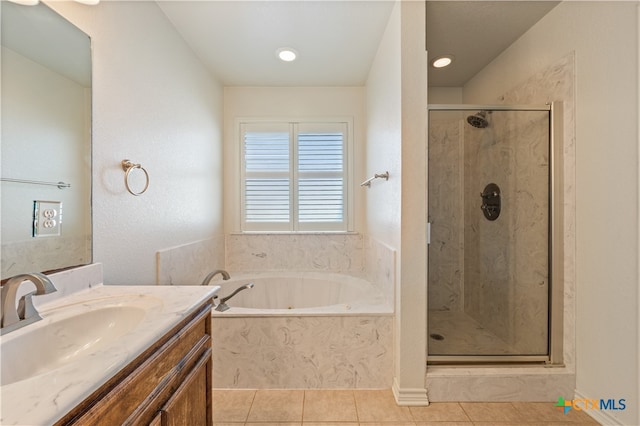 bathroom with tile patterned floors, vanity, and independent shower and bath