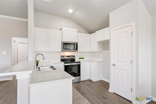 kitchen with white cabinetry, sink, stainless steel appliances, tasteful backsplash, and light hardwood / wood-style flooring