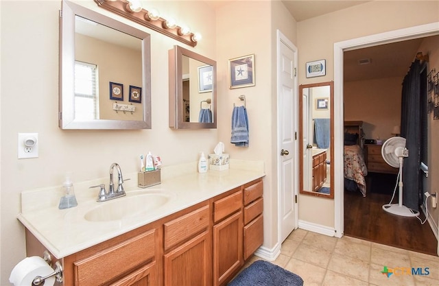 16 Peggy St, Palacios, TX 77465 - bathroom featuring tile patterned flooring and vanity