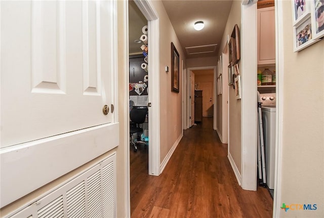 16 Peggy St, Palacios, TX 77465 - hall with dark hardwood / wood-style flooring and washer / dryer