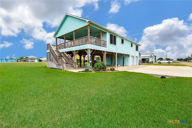 16 Peggy St, Palacios, TX 77465 - rear view of property with a yard, a porch, and a carport