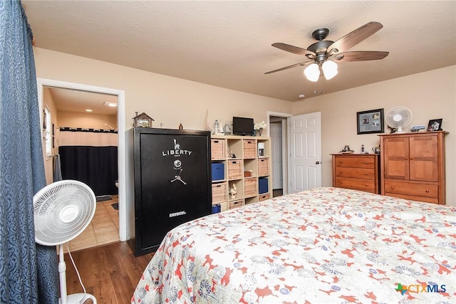16 Peggy St, Palacios, TX 77465 - bedroom featuring ceiling fan and dark hardwood / wood-style floors