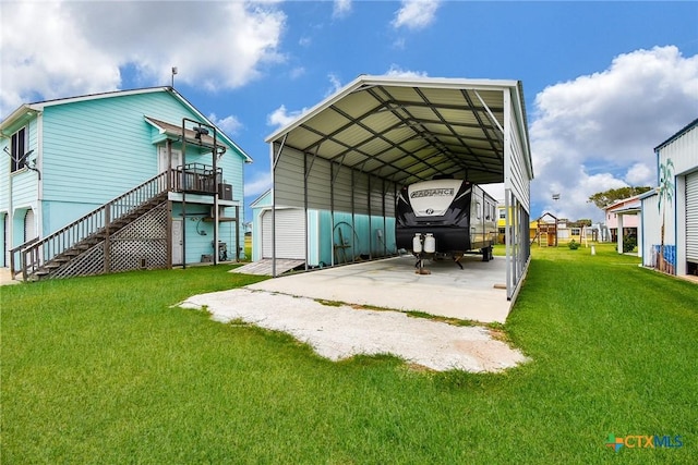16 Peggy St, Palacios, TX 77465 - exterior space with a yard and a carport