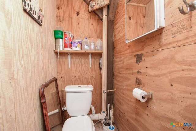 16 Peggy St, Palacios, TX 77465 - bathroom with toilet and wood walls