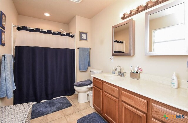 16 Peggy St, Palacios, TX 77465 - bathroom featuring tile patterned floors, vanity, toilet, and walk in shower