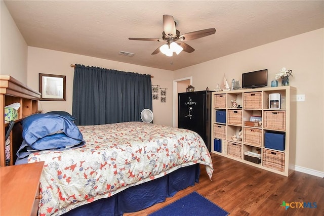 16 Peggy St, Palacios, TX 77465 - bedroom featuring dark hardwood / wood-style floors and ceiling fan