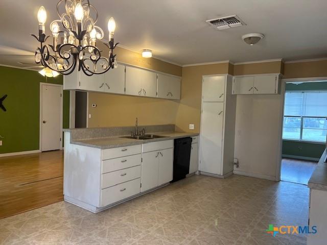 kitchen featuring white cabinets, a sink, visible vents, black dishwasher, and ornamental molding