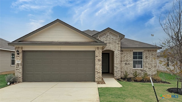 view of front facade with a garage and a front yard