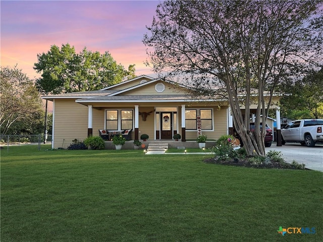 720 E Travis St, Luling, TX 78648 - view of front of house featuring covered porch and driveway