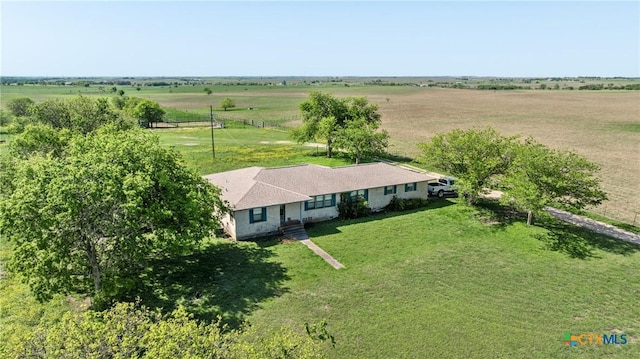 birds eye view of property with a rural view
