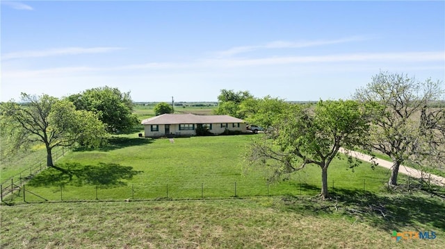 exterior space featuring fence and a rural view
